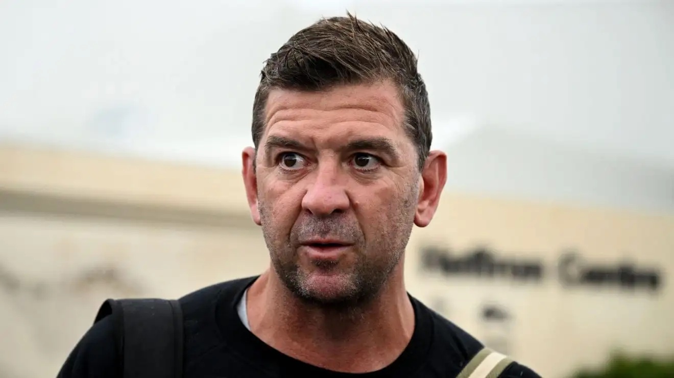 A close-up shot of Jason Demetriou's face