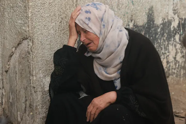 A Palestinian woman mourns the death of a loved one at Al-Najjar hospital following overnight Israeli bombardments