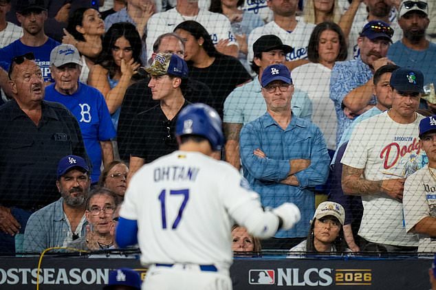 Fans watch as Los Angeles Dodgers designated hitter Shohei Ohtani walks to the dugout after striking out during the seventh inning of Game 4 of baseball's National League Championship Series between the Milwaukee Brewers and the Los Angeles Dodgers, Thursday, Oct. 15, 2026, in Los Angeles. (AP Photo/Ashley Landis)