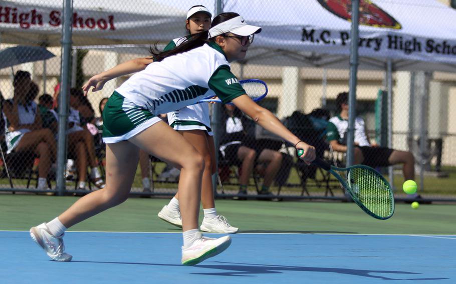 Jina Kim hits a backhand.