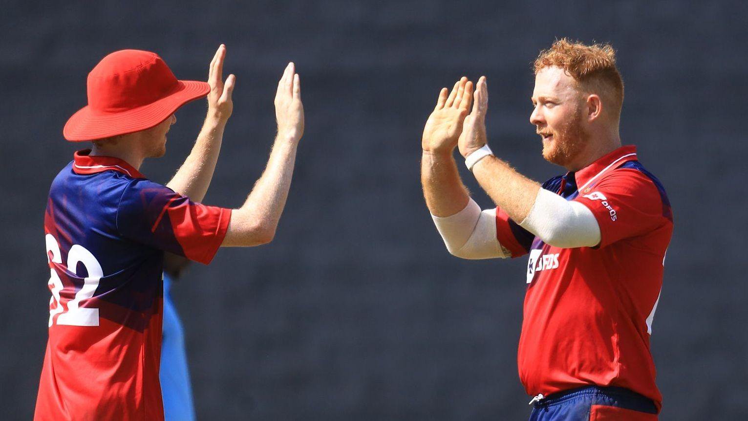 Ben Ward (right) celebrates taking a wicket