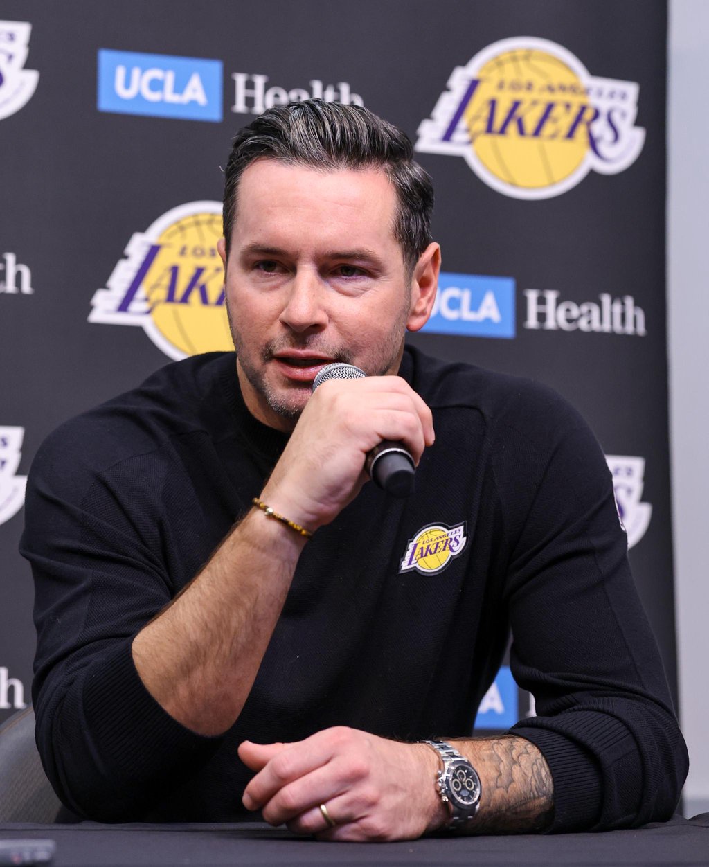 Los Angeles Lakers head coach JJ Redick attends a news conference before a preseason game against the Golden State Warriors at T-Mobile Arena on Tuesday, Oct. 13, 2026, in Las Vegas, Nevada.