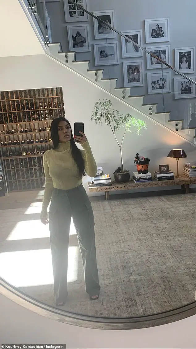 Not a care: Kourtney Kardashian embodied tranquility on Friday afternoon as she posed for selfies in her lavish Calabasas home