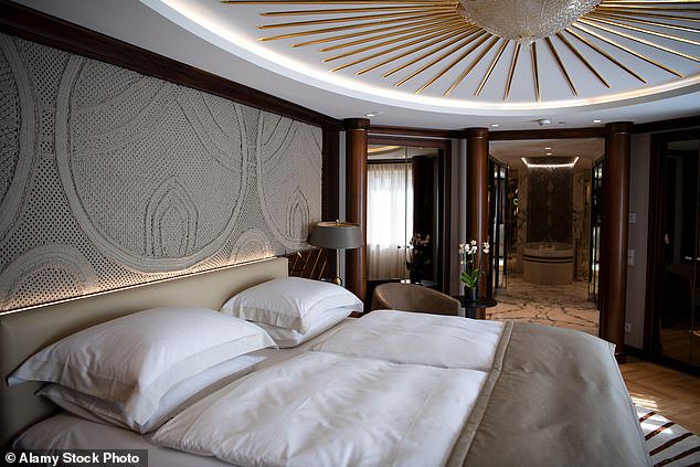 The former Tottenham star, has been staying in a £10,000 per night suite at Munich's Vier Jahreszeiten Kempinski Hotel (above) and has reportedly racked up a bill of over £1m to date