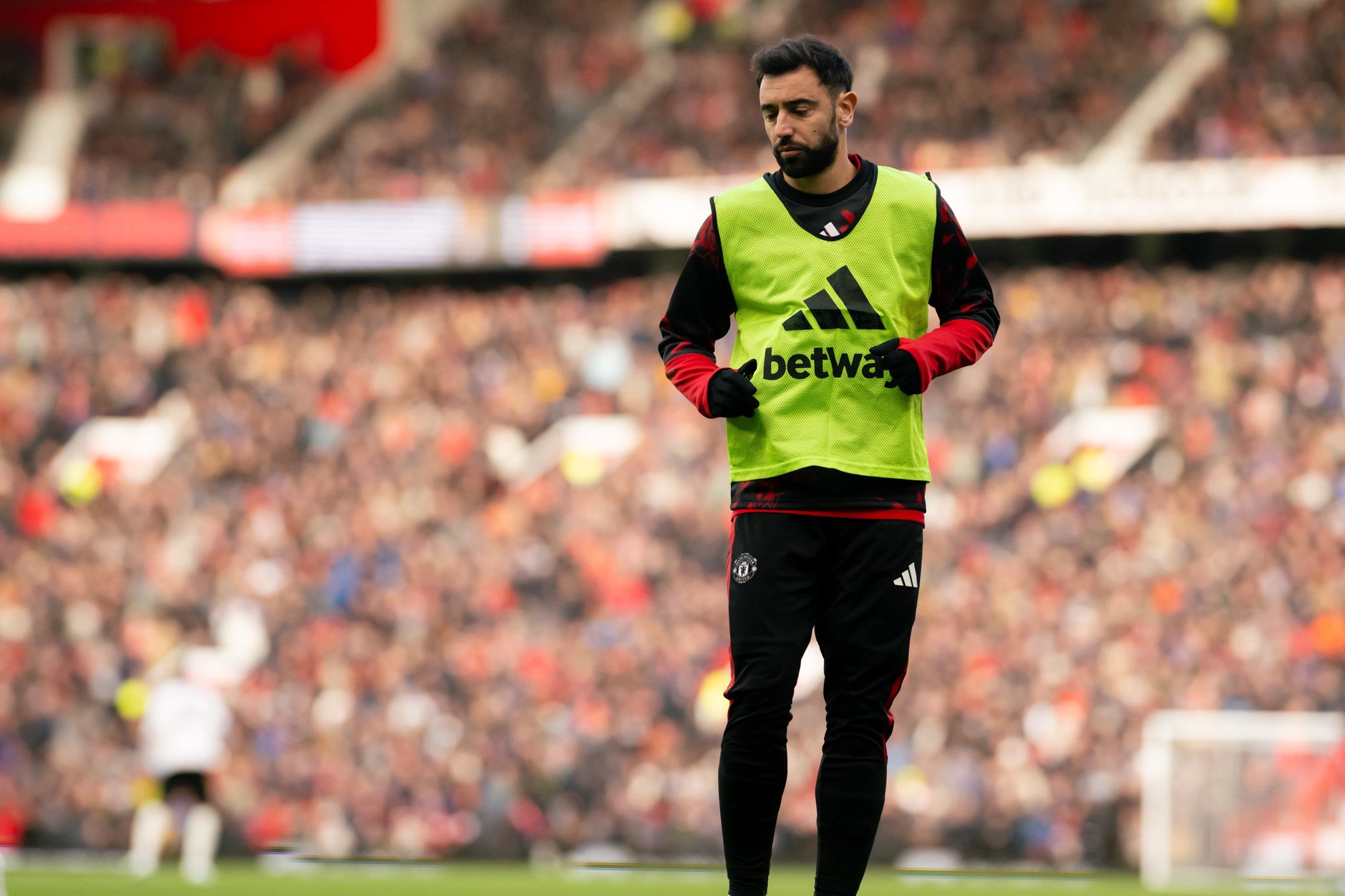 Bruno Fernandes warms up for Manchester United against Brighton in the Premier League.