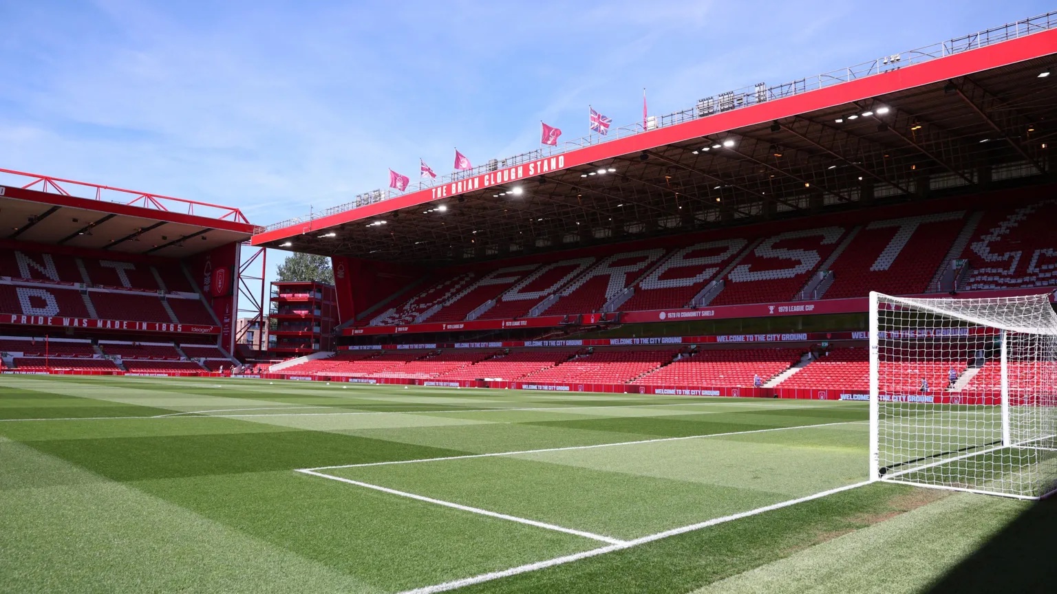 Action Images/Reuters Picture of the red and white stands of the Nottingham Forest football ground, around the pitch in front of the blue sky. 