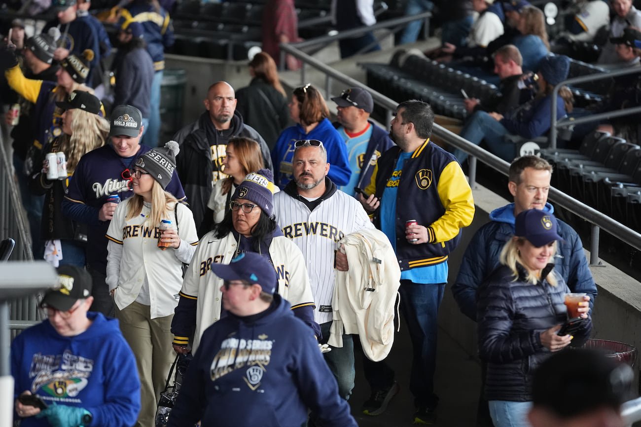 Milwaukee Brewers fans arrive for a rally during the baseball team's World Series parade,...