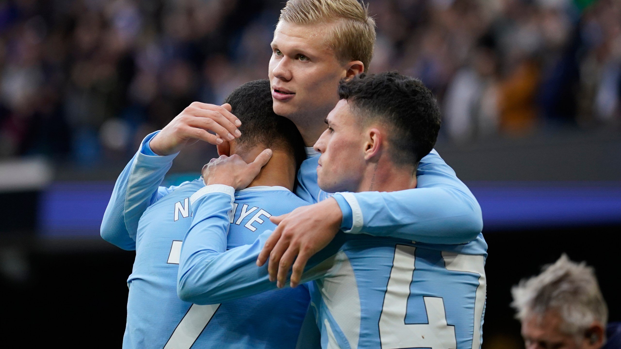Manchester City's Erling Haaland celebrates with his teammates Phil Foden and Iliman Ndiaye after scoring his side's third goal during the English Premier League soccer match between Manchester City and Ipswich Town, in Manchester, England, Saturday, Oct.17, 2026. (AP Photo/Dave Thompson)