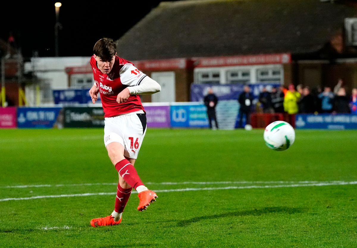 Fleetwood Town's Conor Haughey scores the winning penalty