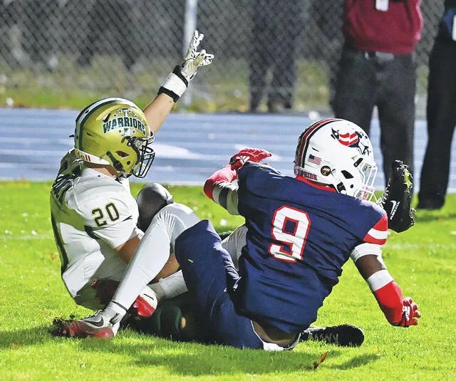 <p>After Wyoming Area quarterback Luke Kopetchny’s pass was deflected in the end zone, teammate Lucas Viadock (20) caught the ball to score the final Warrior touchdown ending the game at 28-20 giving Wyoming Area the victory.</p>
                                 <p>Tony Callaio | For Times Leader</p>