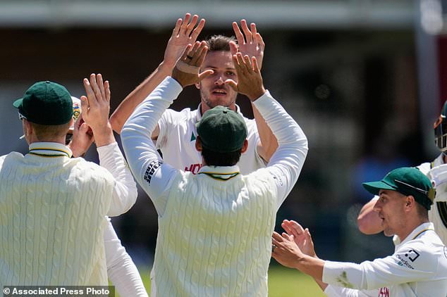 South Africa's Marco Jansen, centre, celebrates the wicket of Australia's Matt Renshaw during day four of the second cricket test match between South Africa and Australia, in Gqeberha, South Africa, Wednesday, Oct. 21, 2026. (AP Photo/Themba Hadebe)