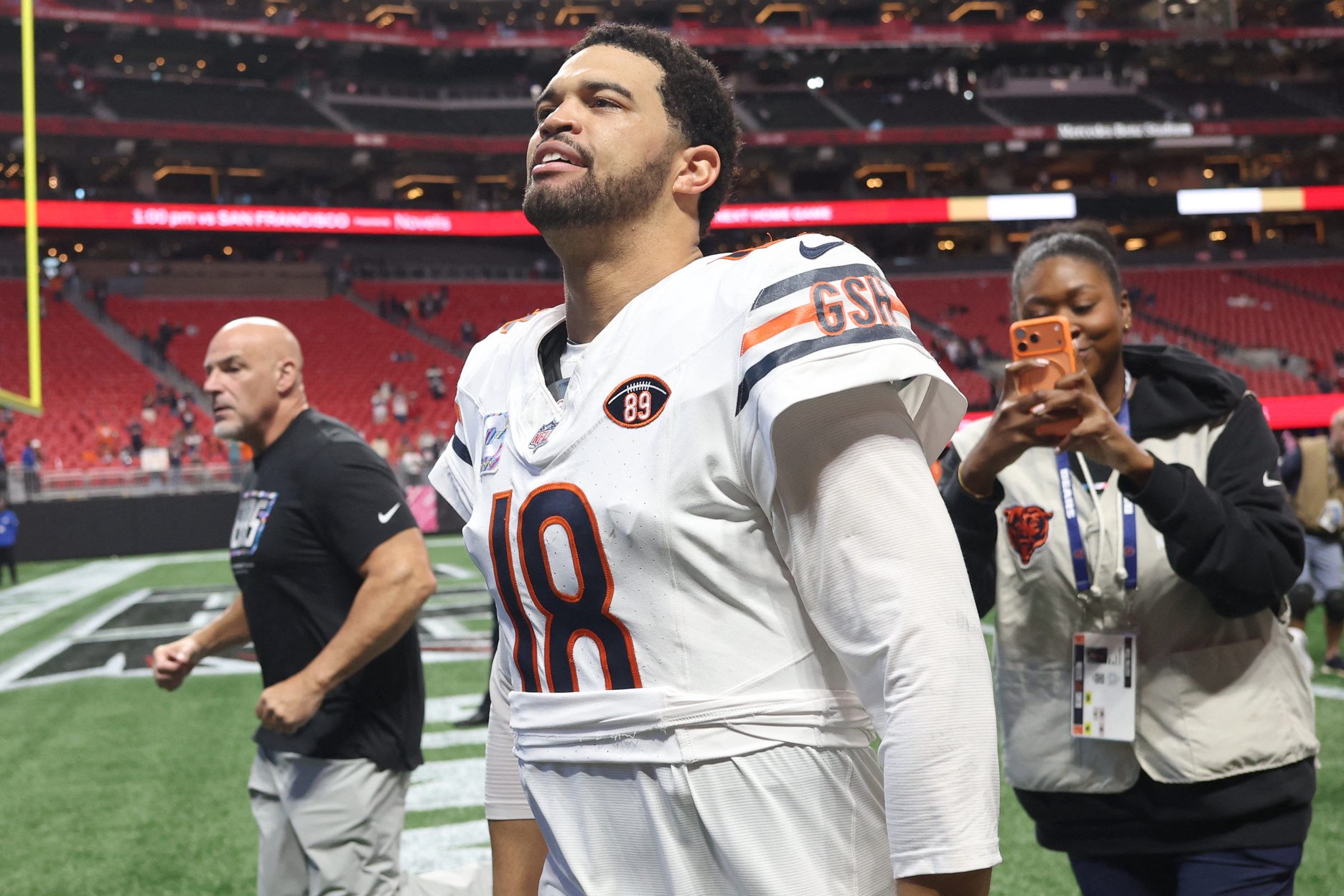 Chicago Bears quarterback Caleb Williams (18) walks off the field after the game against the Atlanta Falcons at Mercedes-Benz Stadium. 