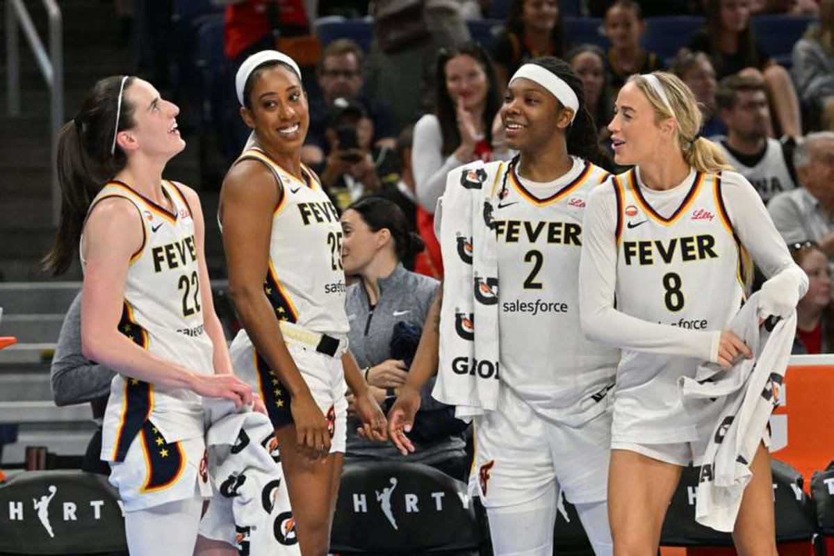 Aug 23, 2026; Chicago, Illinois, USA; Indiana Fever guard Caitlin Clark (22), forward Monique Billings (25), forward Myisha Hines-Allen (2) and guard Sophie Cunningham (8) celebrate from the bench against the Chicago Sky during the second half at Wintrust Arena. © Patrick Gorski-Imagn Images