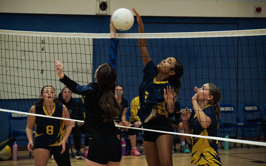 Ailee Sinclair tries to tip the ball over.