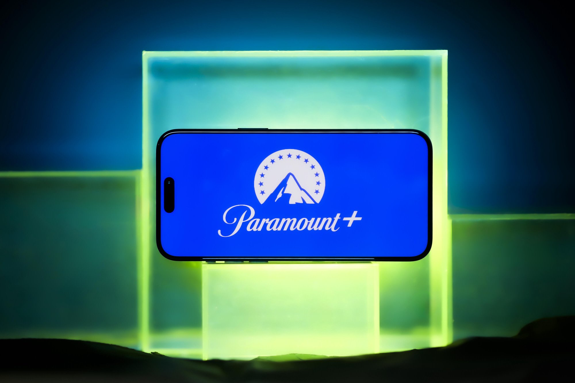 Paramount Plus logo on neon backdrop