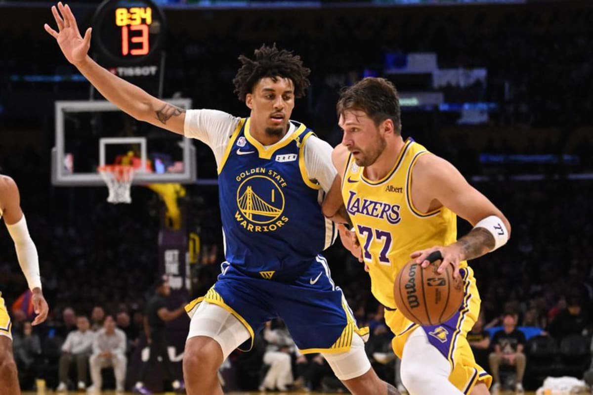 Guard Luka Doncic #77 of the Los Angeles Lakers drives to the basket against forward Yaxel Lendeborg #1 of the Golden State Warriors in the second half of a NBA playoff basketball game at Crypto.com Arena in Los Angeles on Wednesday, October 21, 2026
