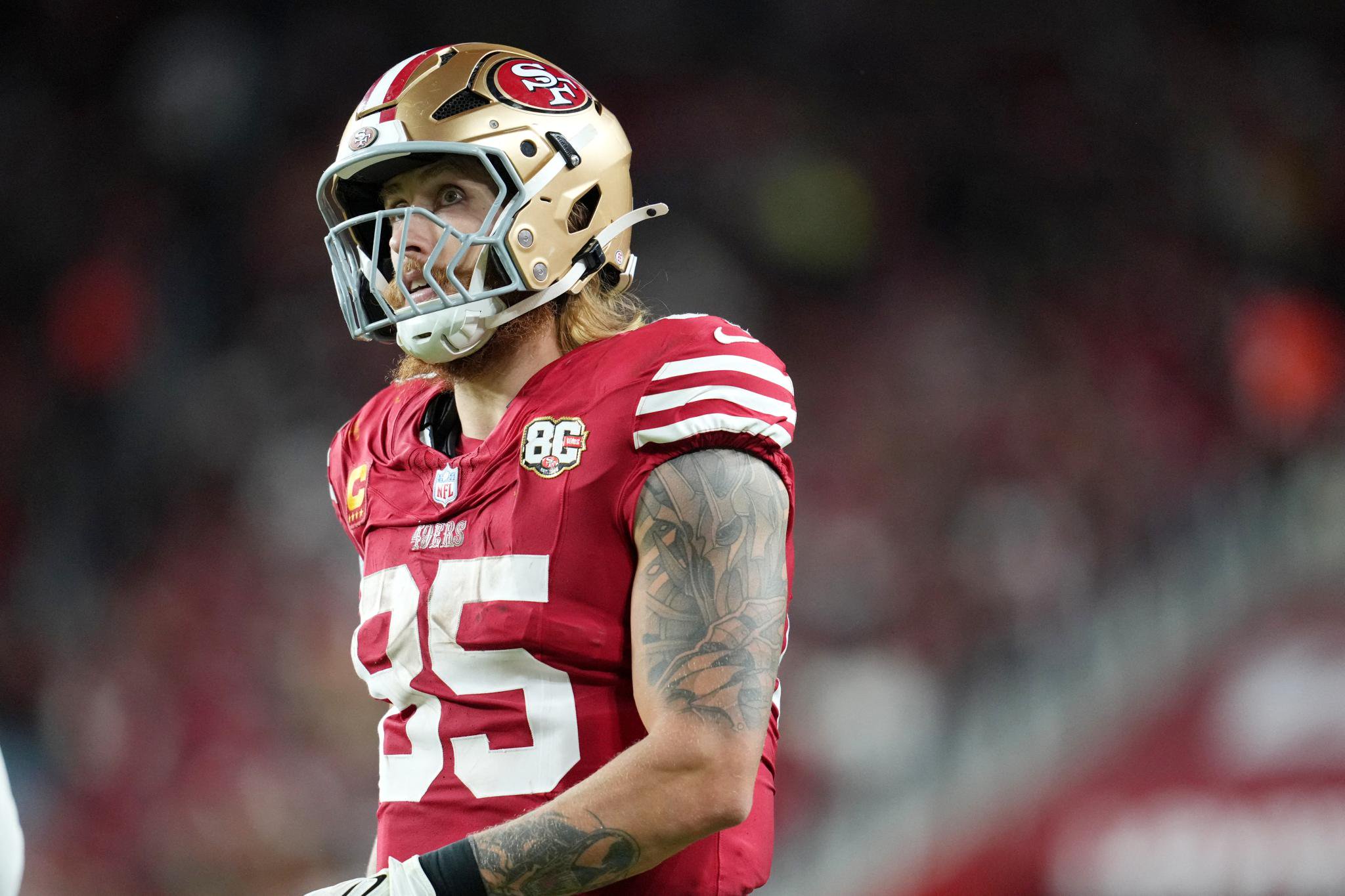 San Francisco 49ers tight end George Kittle looks on during the third quarter against the Washington Commanders.