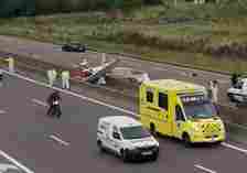 Horror footage showed emergency services rushing around the upturned aircraft