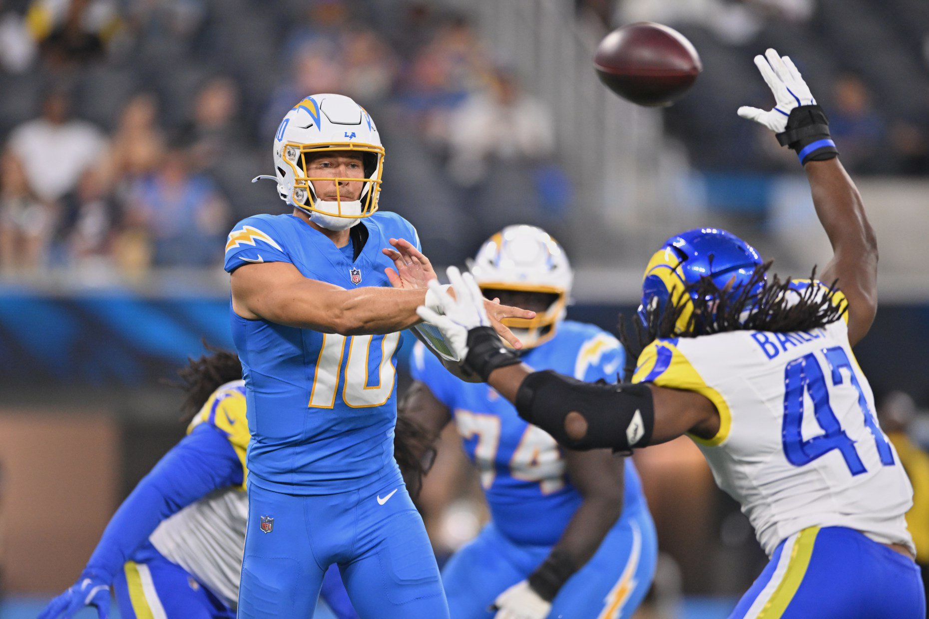 Los Angeles Chargers quarterback Justin Herbert throws a pass during the first half of an NFL preseason football game against the Los Angeles Rams Thursday, Aug. 27, 2026, in Inglewood, Calif. (AP Photo/Katie Chin)