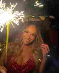 mariah carey holding a sparkler