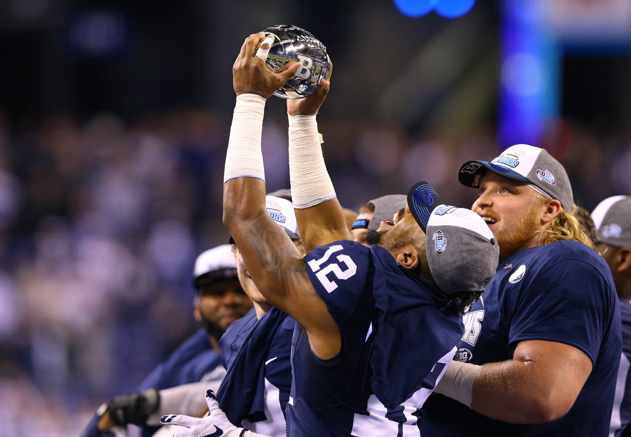 Dec 3, 2016; Indianapolis, IN, USA; Penn State Nittany Lions wide receiver Chris Godwin (12) reacts as he holds the Big Ten Championship trophy after defeating the Wisconsin Badgers in the Big Ten Championship college football game at Lucas Oil Stadium. Penn State won 38-31. Mandatory Credit: Aaron Doster-USA TODAY Sports