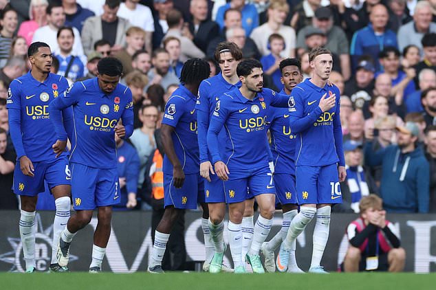 Chelsea's Cole Palmer, right, celebrates after scoring his side's second goal during the English Premier League soccer match between Chelsea and Manchester United in London, Saturday, Oct. 31, 2026. (AP Photo/Ian Walton)