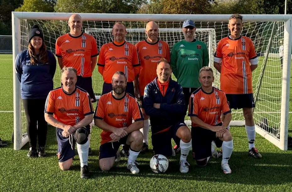 Stratford Town Walking Football under-50s smile for the camera.