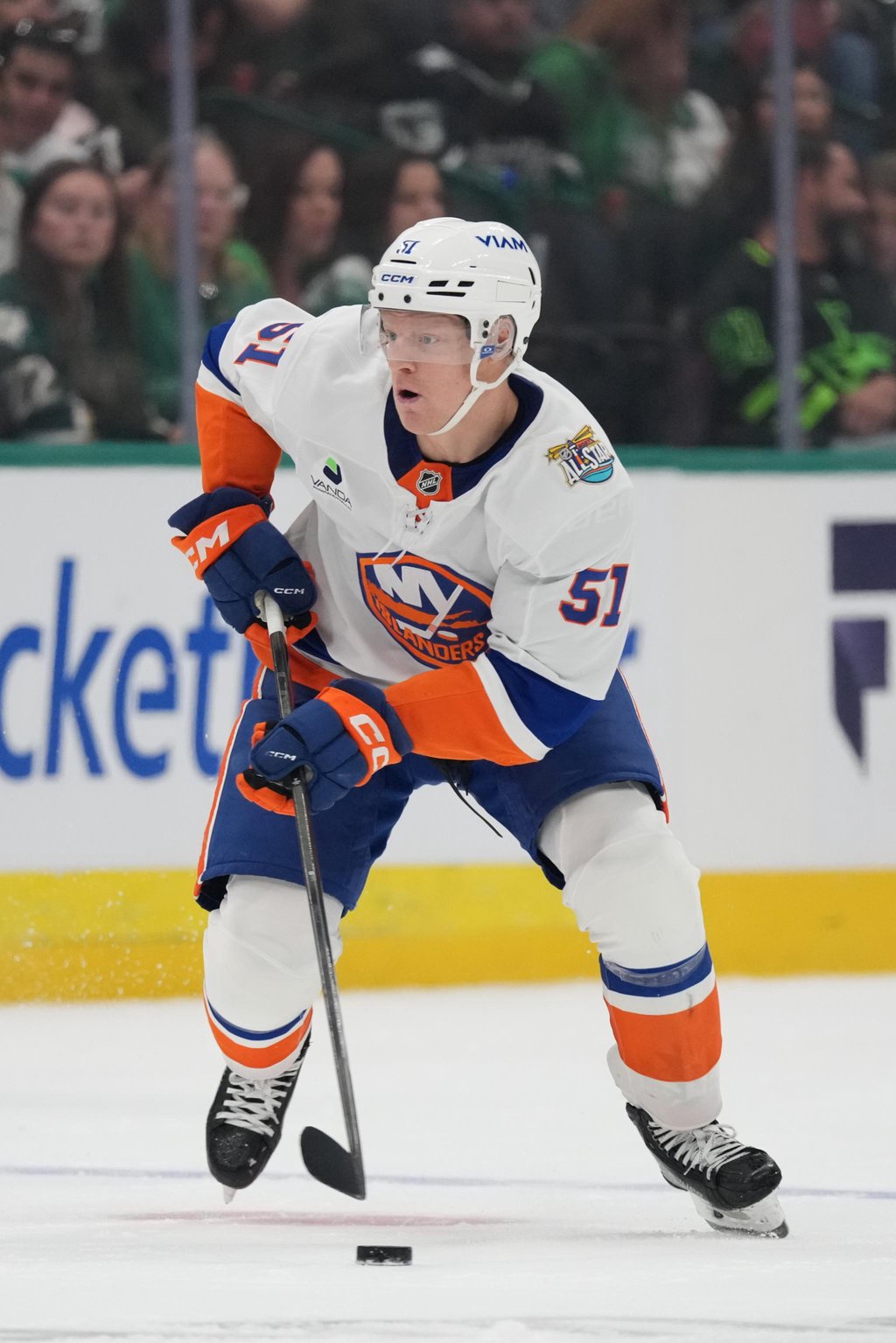 Emil Heineman of the New York Islanders handles the puck against the Dallas Stars.