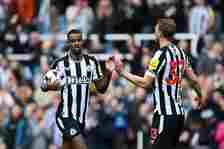 Alexander Isak of Newcastle United celebrates scoring his team's first goal with teammate Dan Burn during the Premier League match between Newcastl...
