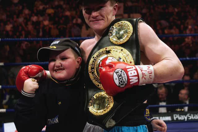 Ricky Hatton of England celebrates with his belt after the WBU light welterweight Championship of the World fight between Hatton and Joe Hutchinson of the USA on December 14, 2002 at the Telewest Arena in Newcastle, England.   (Photo by John Gichigi/Getty Images)