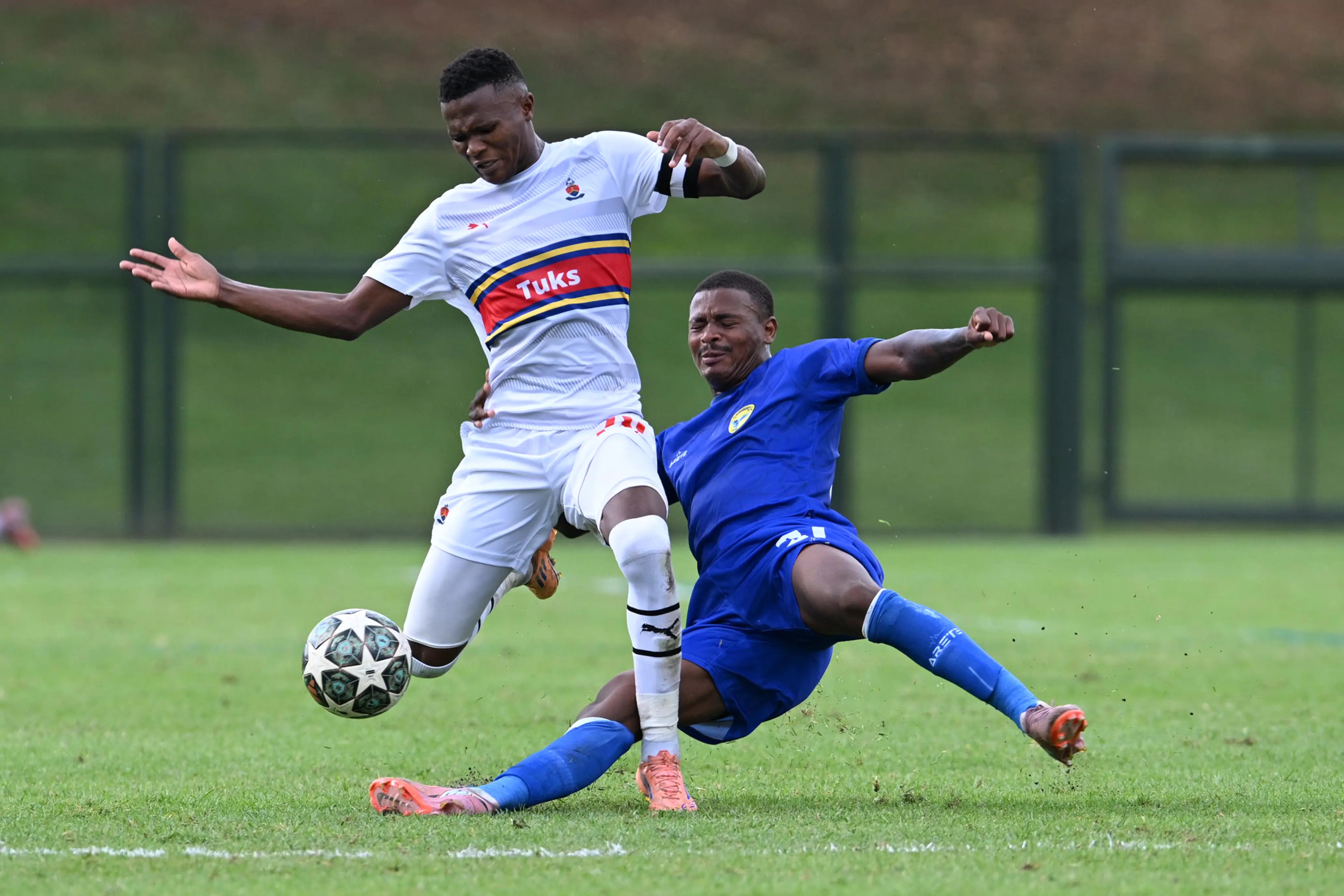 Sibongakonke Mgwaba, of University of Pretoria, and Mervin Boji, of Highbury, clash during a Motsepe Foundation Championship soccer match in Pretoria Picture: LEFTY SHIVAMBU/GALLO IMAGES