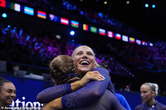 Reese Esponda, and Dulcy Caylor, left, of the United States, hug each other during the women's team final at the Artistic Gymnastics World Championships in Rotterdam, the Netherlands, Wednesday, Oct. 21, 2026. (AP Photo/Francisco Seco)