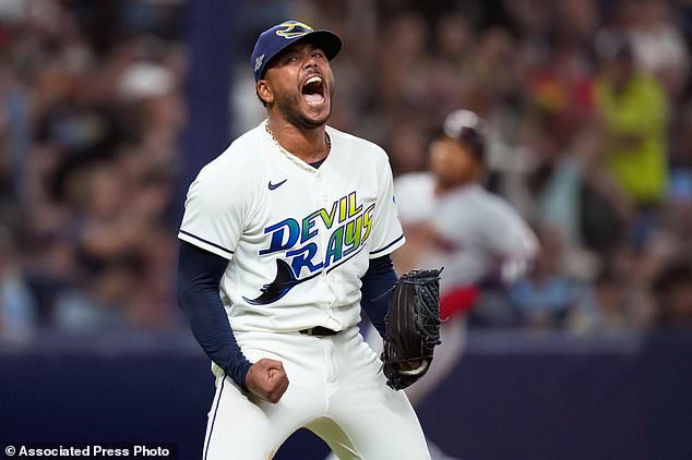 Tampa Bay Rays pitcher Freddy Peralta celebrates the last out in the top of the fifth inning in Game 2 of an American League Championship Series baseball game against the Cleveland Guardians in St. Petersburg, Fla. Tuesday, Oct. 13, 2026. (AP Photo/David J. Phillip)