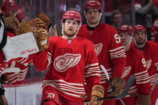 Detroit Red Wings left wing Viktor Arvidsson (33) celebrates his goal against the Chicago Blackhawks in the second period of an NHL hockey game Thursday, Oct. 29, 2026, in Detroit. (AP Photo/Paul Sancya)