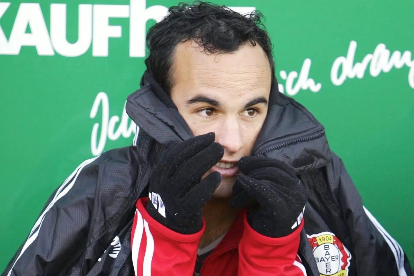 Landon Donovan covering his face.