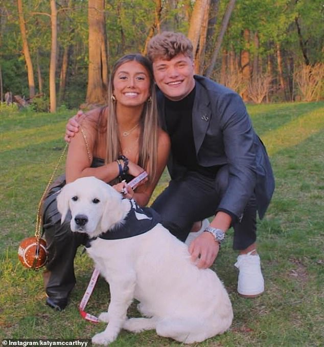 Katya and JJ are seen with their dog. The couple has been together since high school