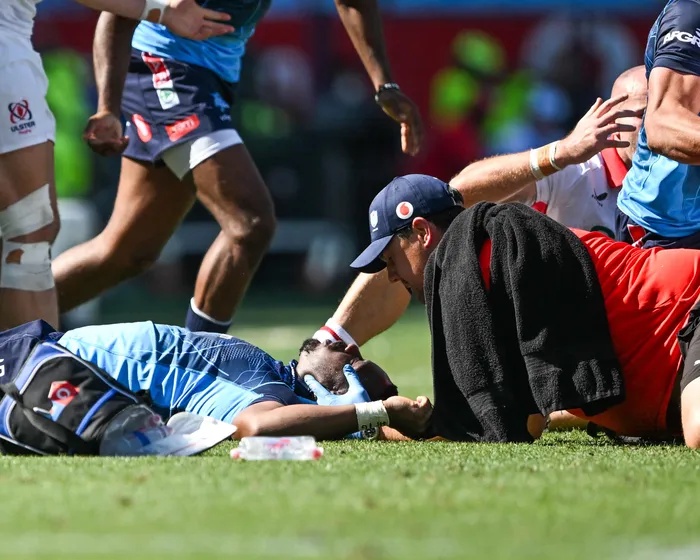 Centre Sango Xamlashe of the Vodacom Bulls receives medical attention during the United Rugby Championship match.