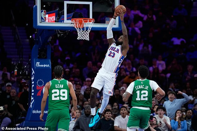 Philadelphia 76ers' LeBron James goes up for a dunk during the first half of a preseason NBA basketball game against the Boston Celtics Friday, Oct. 16, 2026, in Philadelphia. (AP Photo/Matt Slocum)