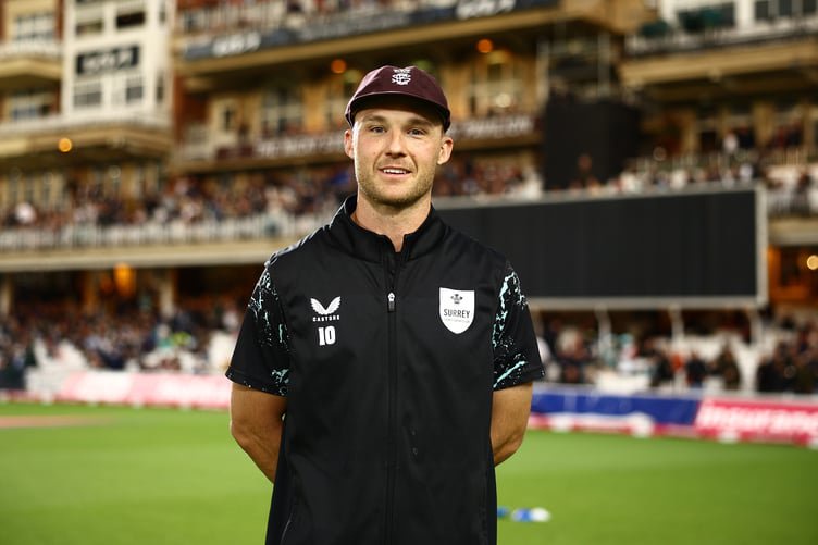 LONDON, ENGLAND - SEPTEMBER 03: Laurie Evans of Surrey is presented with his county cap ahead of the Vitality Blast Men's quarter final match between Surrey and Northamptonshire Steelbacks at The Kia Oval on September 03, 2025 in London, England.  (Photo by Ben Hoskins/Getty Images for Surrey CCC)
