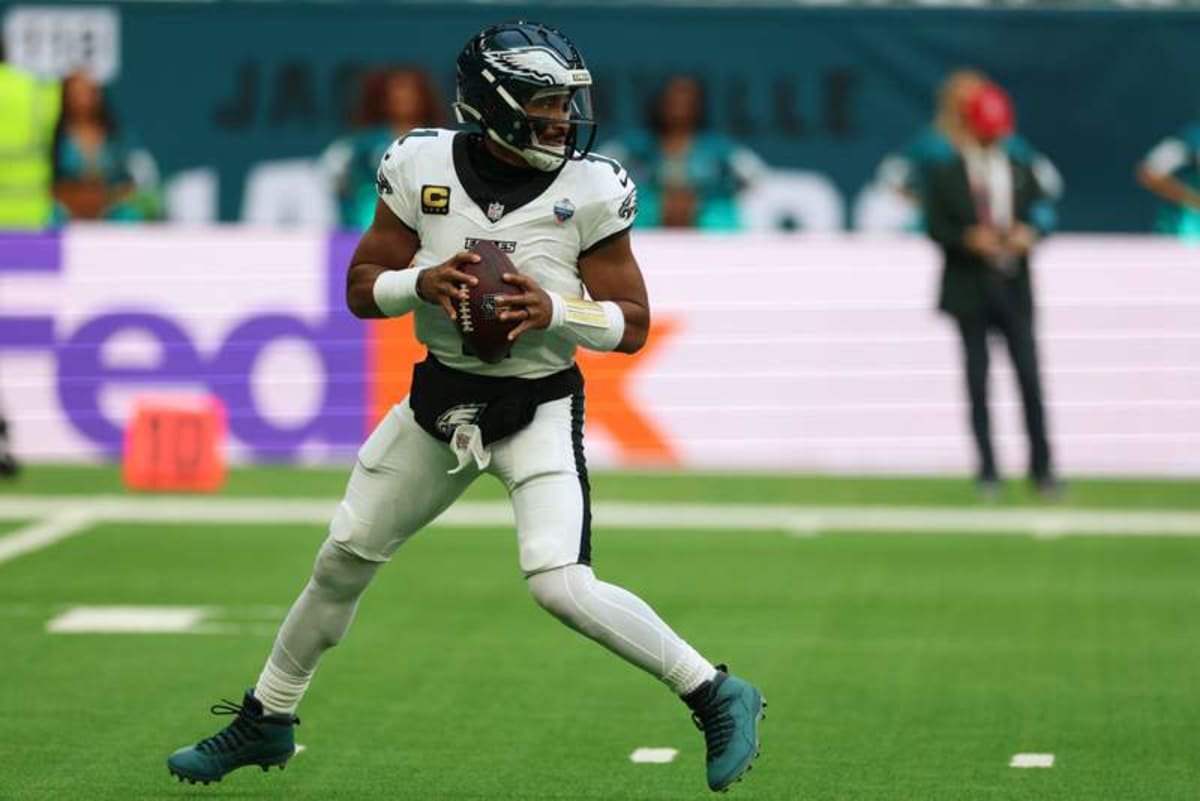 Oct 11, 2026; Tottenham, ENG; Philadelphia Eagles quarterback Jalen Hurts (1) drops back to pass during the second half against the Jacksonville Jaguars at Tottenham Hotspur Stadium. © Nathan Ray Seebeck-Imagn Images