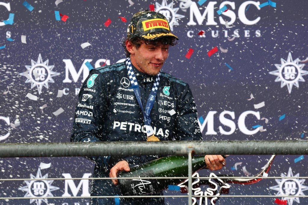 Race winner Andrea Kimi Antonelli of Mercedes celebrates with Champagne on the podium.