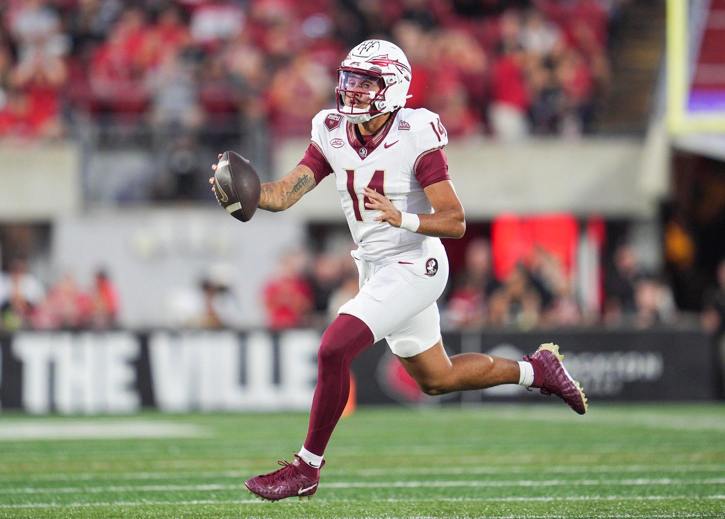 Florida State Seminoles quarterback Ashton Daniels (14) runs for a gain against Louisville during ACC college football at L&amp;N Stadium in Louisville, Kentucky. Oct. 9, 2026.