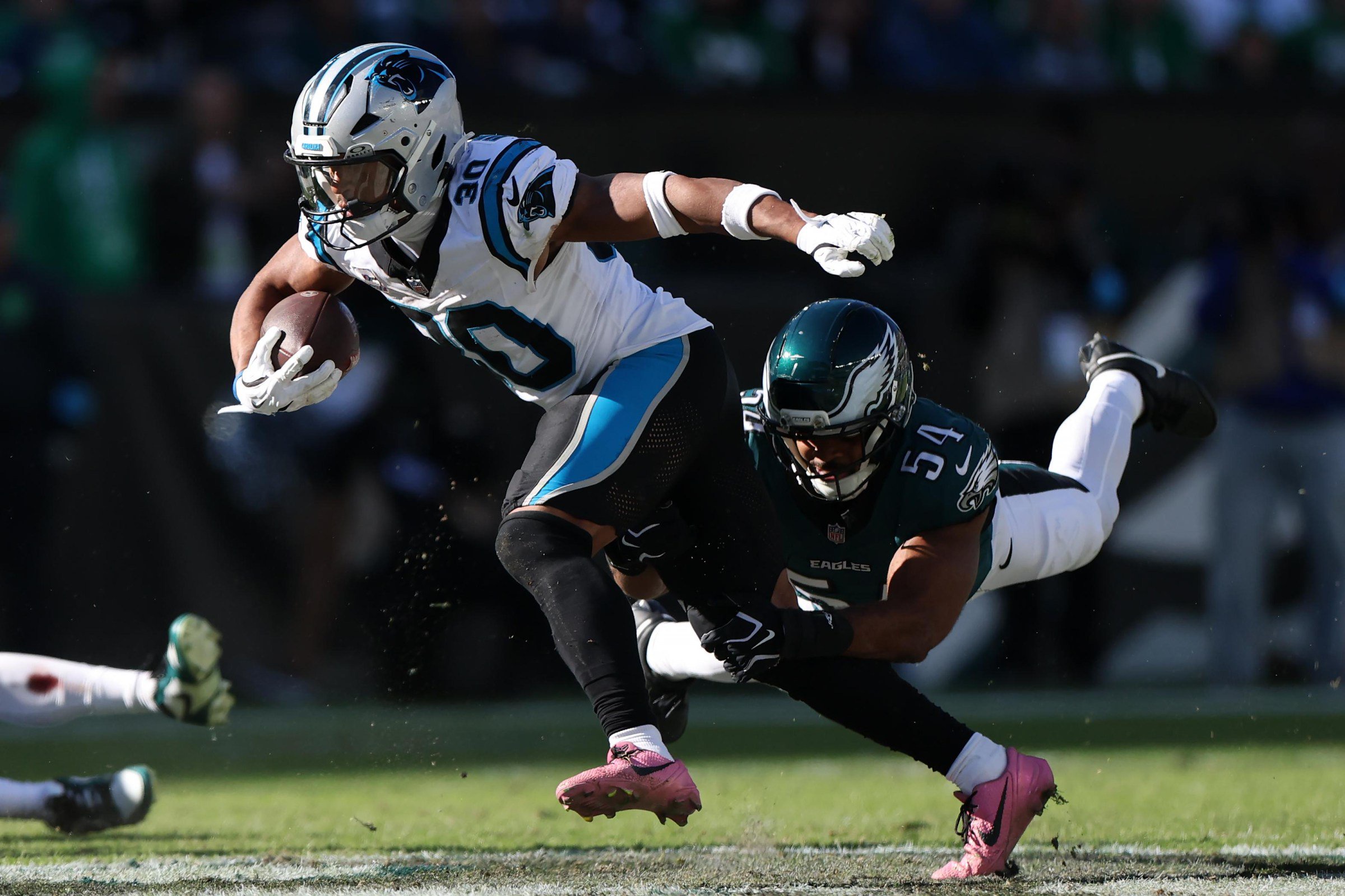 PHILADELPHIA, PENNSYLVANIA - OCTOBER 18: Chuba Hubbard #30 of the Carolina Panthers carries the ball against Jeremiah Trotter Jr. #54 of the Philadelphia Eagles during the third quarter at Lincoln Financial Field on October 18, 2026 in Philadelphia, Pennsylvania. (Photo by Emilee Chinn/Getty Images)