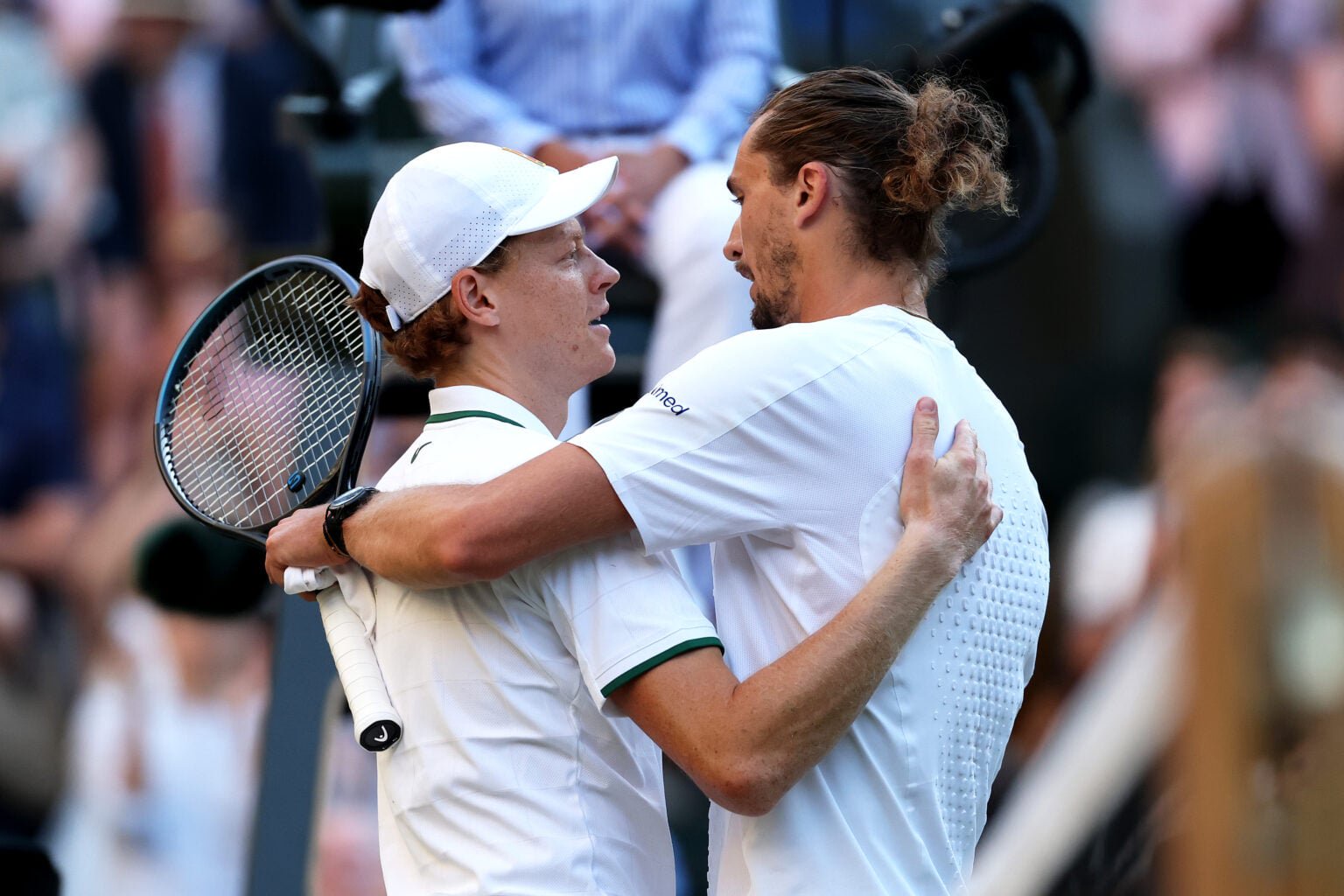 Alexander Zverev and Jannik Sinner embrace after the 2026 Wimbledon final.
