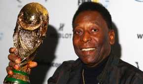 Pele lifting the World Cup trophy.
