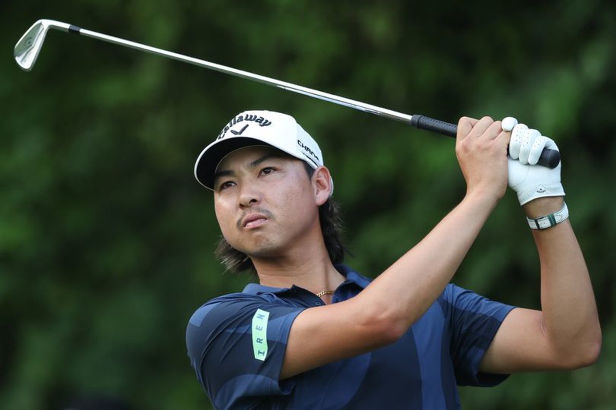 Min Woo Lee hits an iron shot