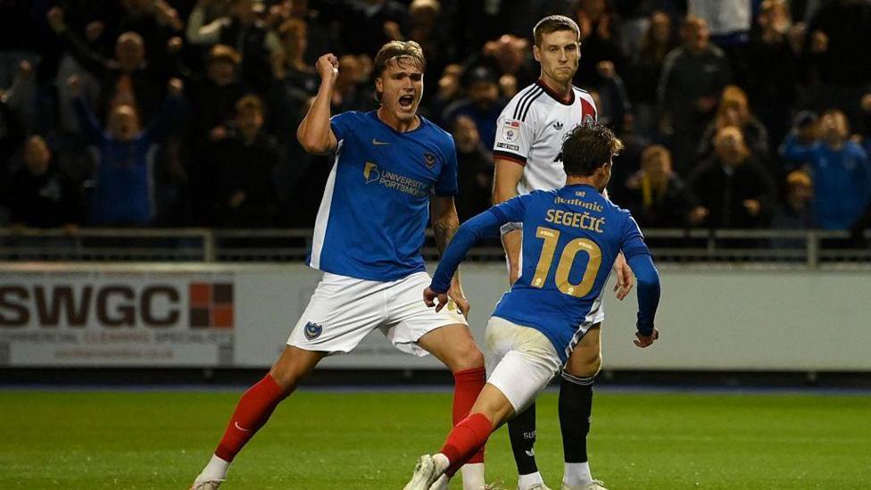 Portsmouth celebrate after scoring 