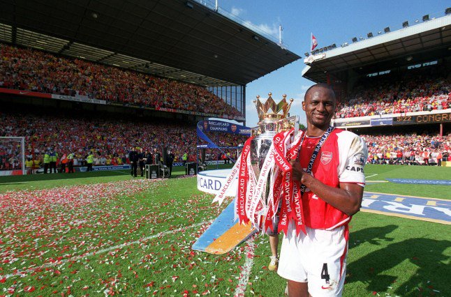 LONDON, ENGLAND - MAY 15: Patrick Vieira of Arsenal with Premier League Trophy after the Premier League match between Arsenal and Leicester City on May 15, 2004 Arsenal Stadium, Highbury in London, England. (Photo by Stuart MacFarlane/Arsenal FC via Getty Images)