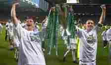 Celtic captain Tom Boyd (R) and Tommy Johnson hold up the cup to the fans at after the Scottish Premier League match between Celtic and Hearts at C...