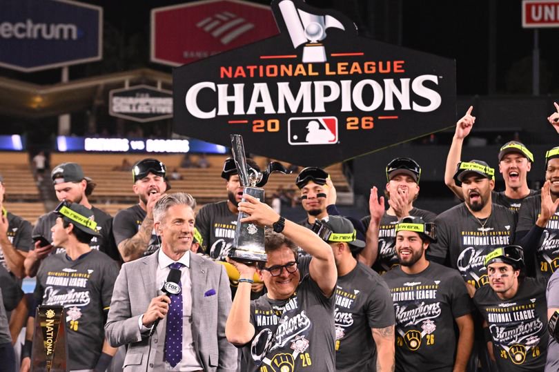 Principal owner of the Milwaukee Brewers, Mark Attanasio hoists up the championship trophy after defeating the Dodgers 6-4 to win Game 4 of a NLCS playoff baseball game and advance to the World Series at Dodger Stadium in Los Angeles on Thursday, October 15, 2026.